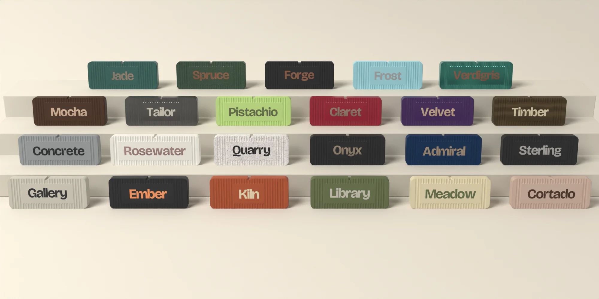 Twenty three fluted name plates on stepped shelves, each in its own named colorway