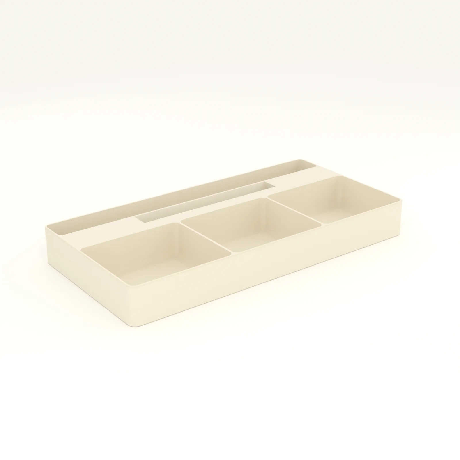 Sand colored desk tray with pens in the channel, a phone in the angled slot and three bays