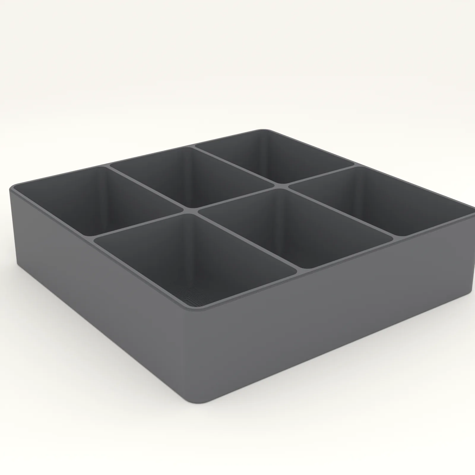 Token tray with six scooped compartments holding wooden cubes and dice