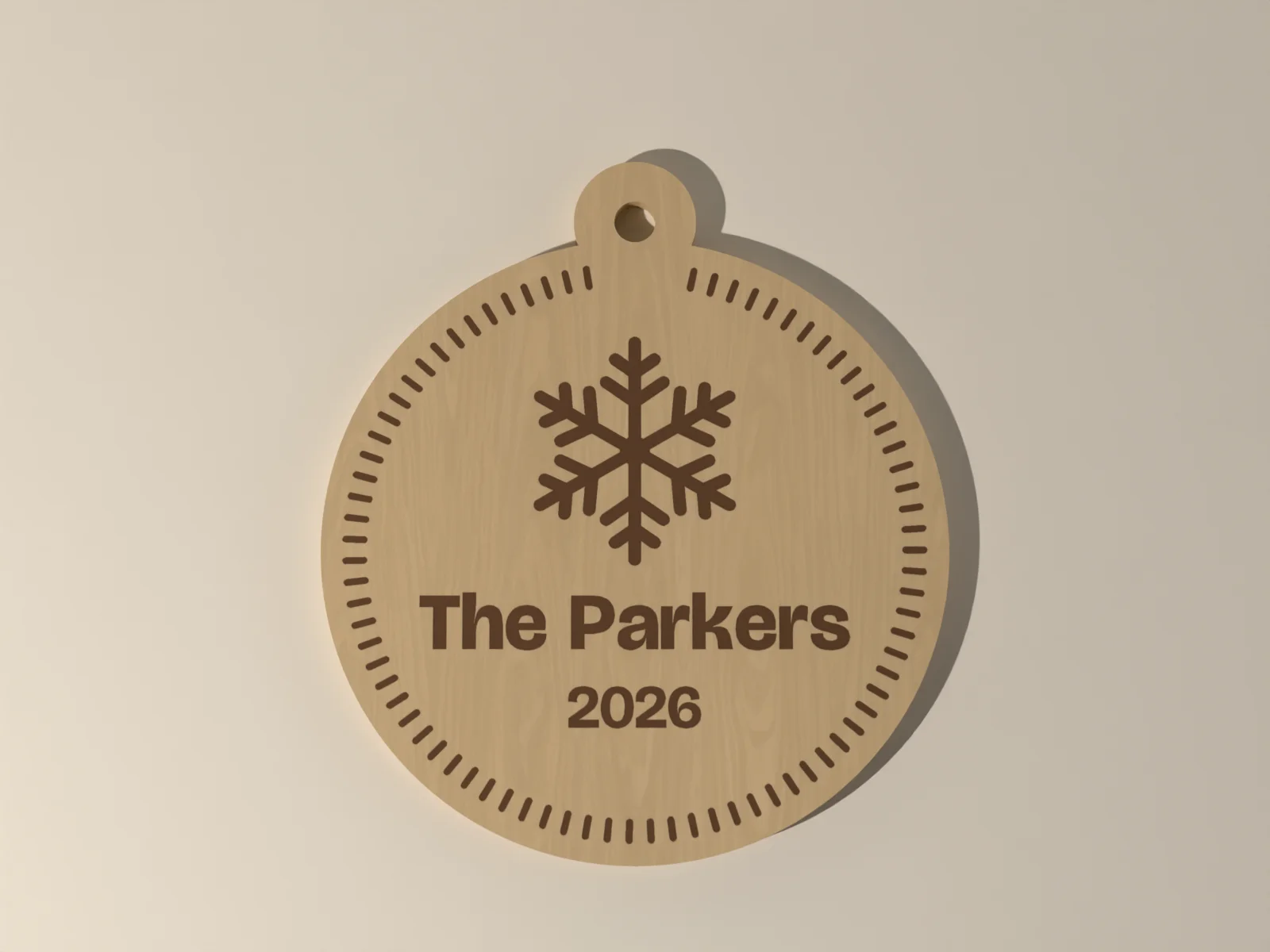Engraved wood ornament from the front, the design, name and year