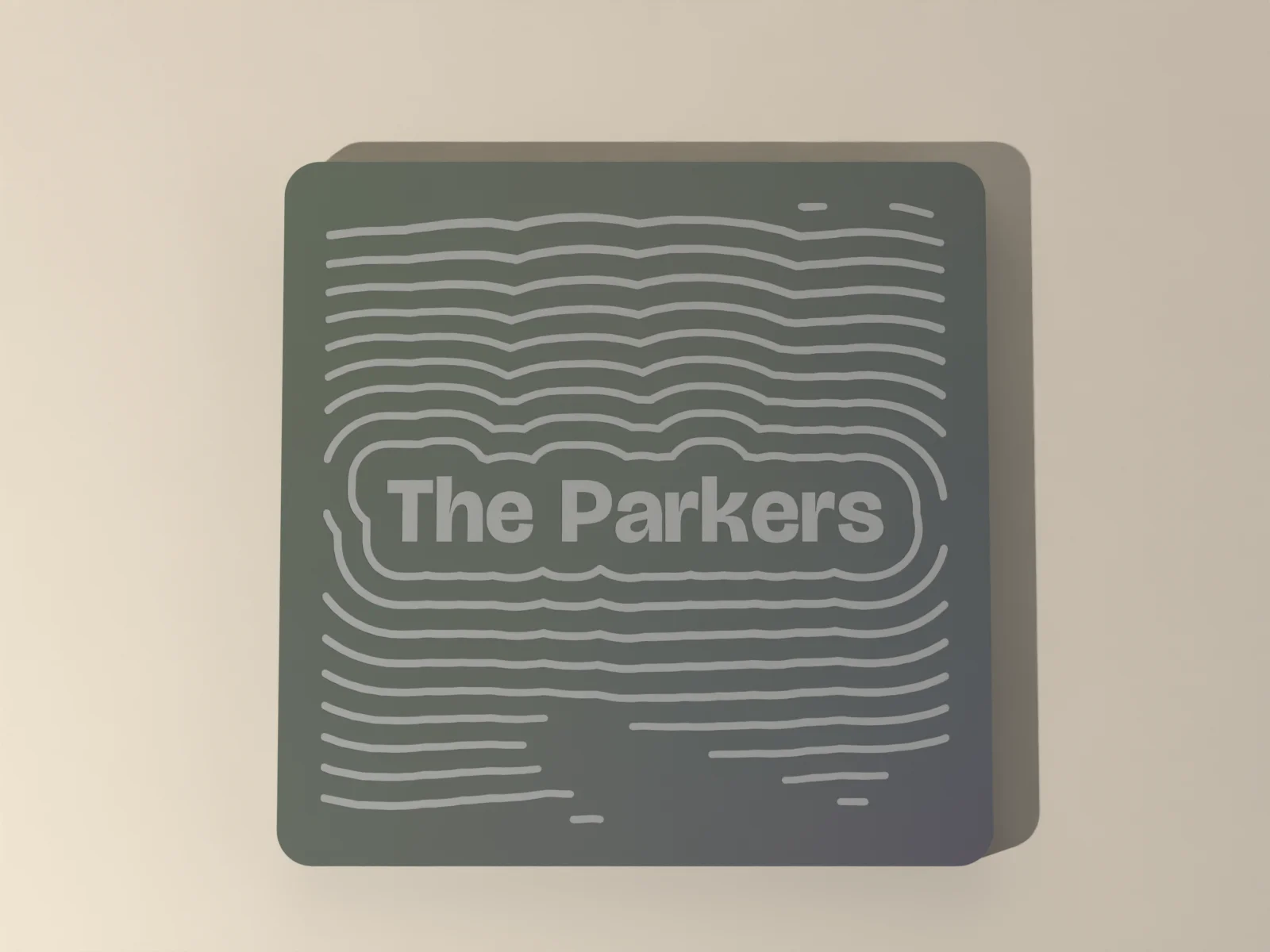 Engraved slate coasters from above, the name and contour rings