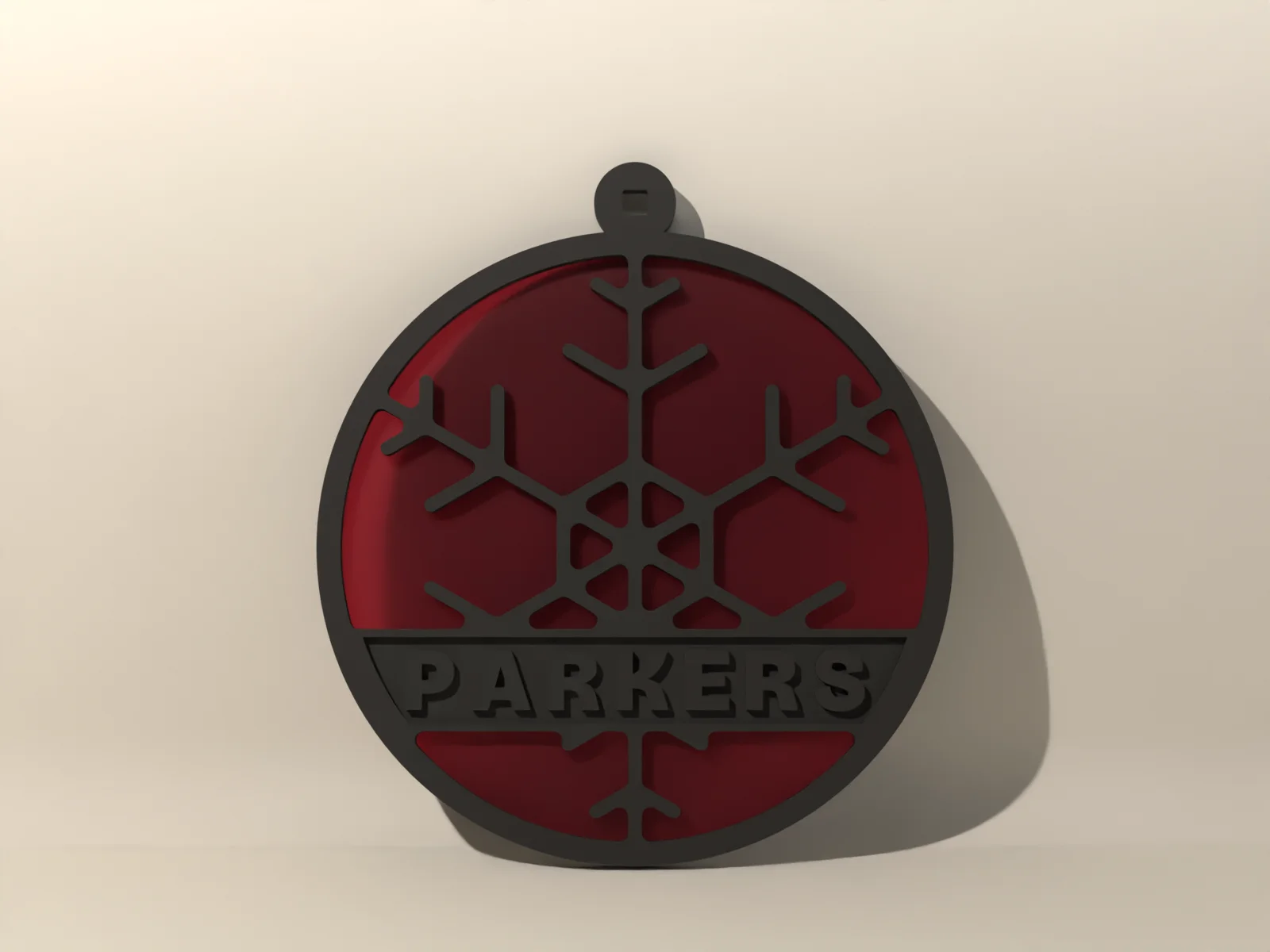 Stained glass ornament from the front with light coming through the ruby panes