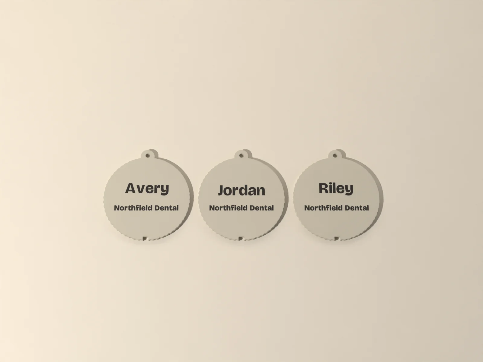 Team ornament from the front, a name above the company name