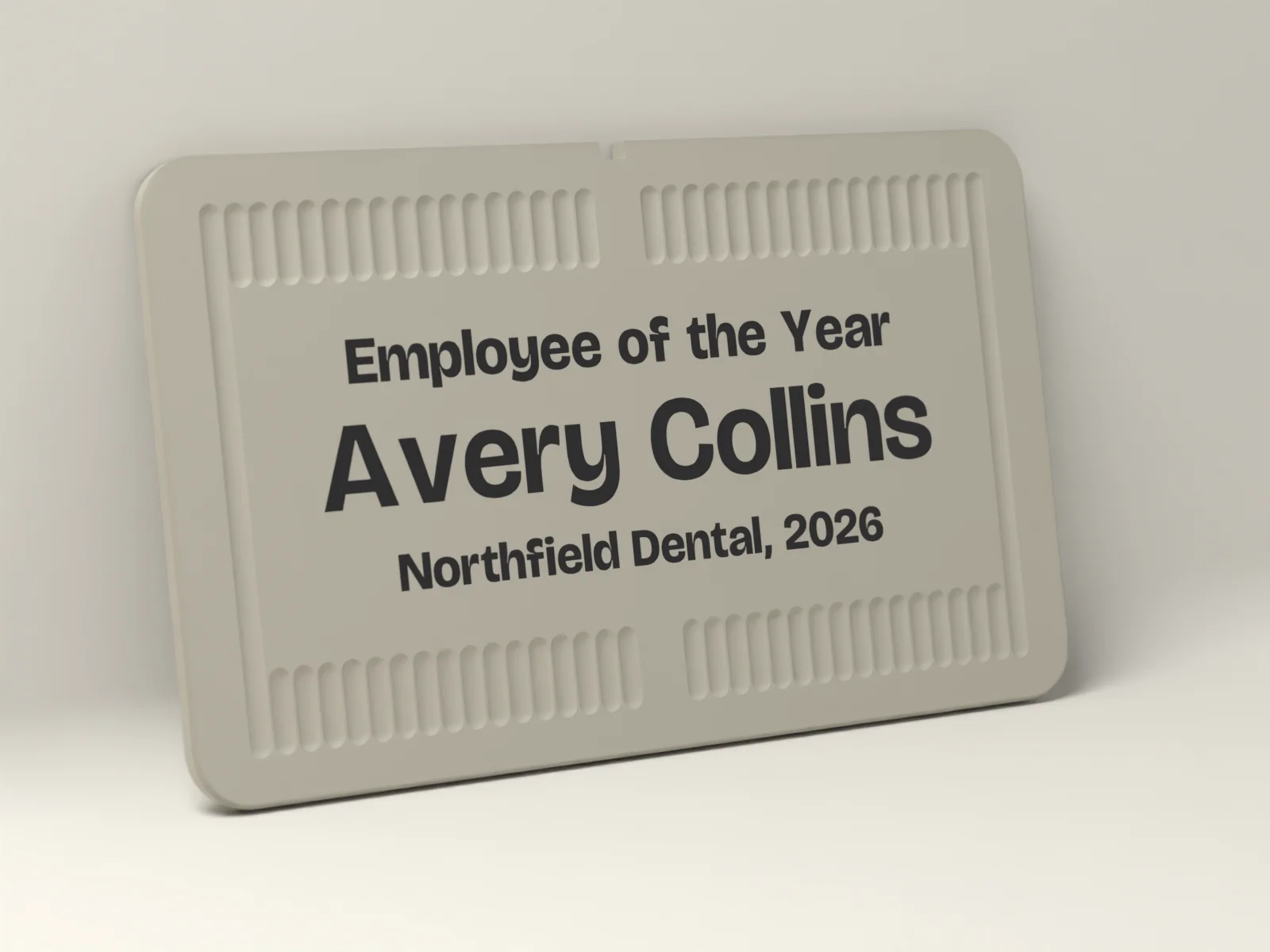 Award plaque in Bone with Employee of the Year, Avery Collins and Northfield Dental, 2026 inlaid flush in Ink, framed by fine reeding