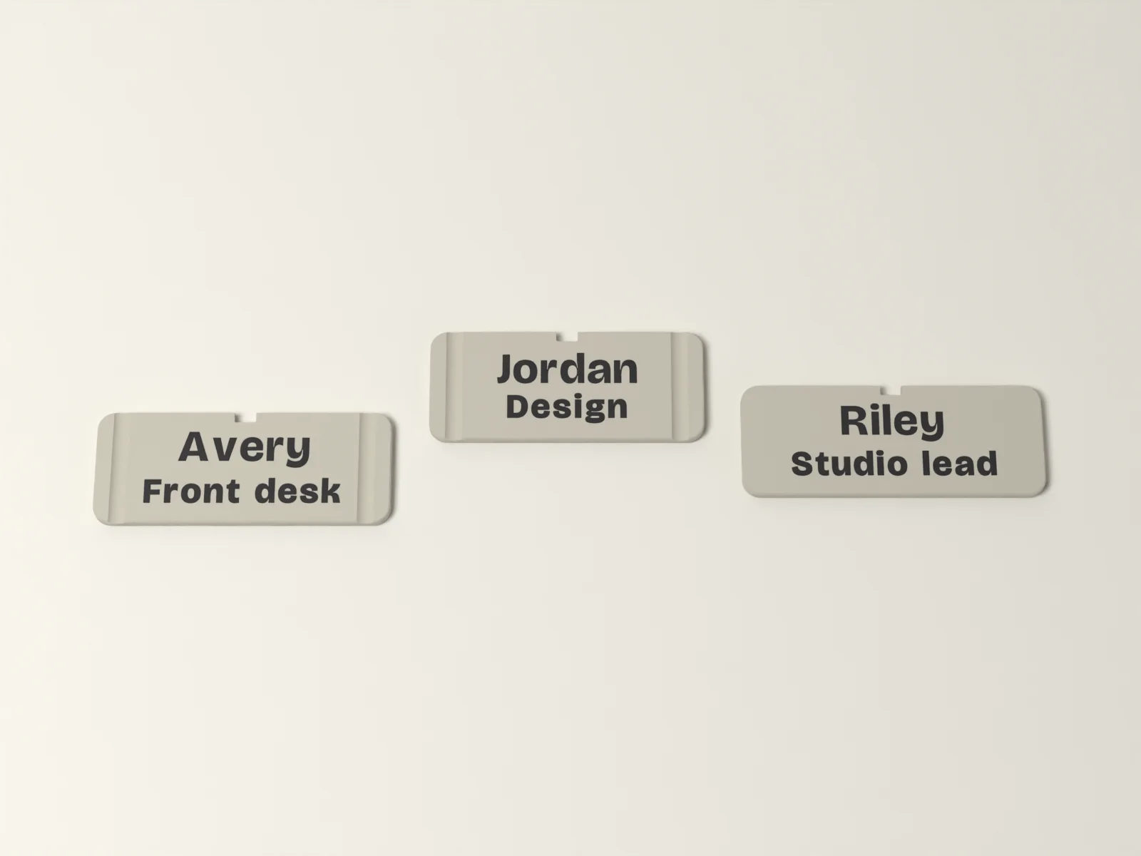 Name badges, a closer look at the inlaid lettering and the keyway notch in the top edge