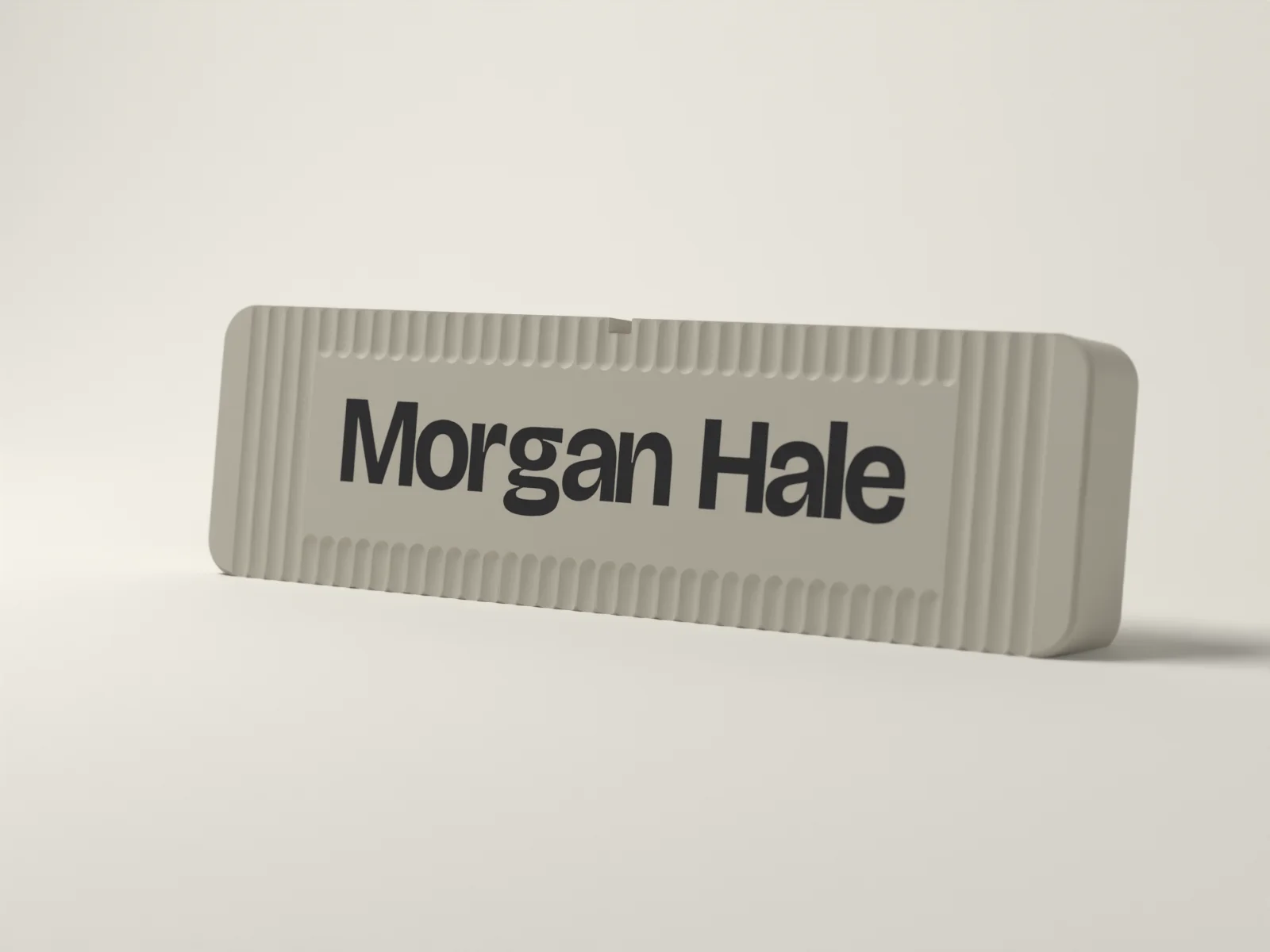 Desk name plate from the side, showing the 22 mm thickness and the eight degree lean