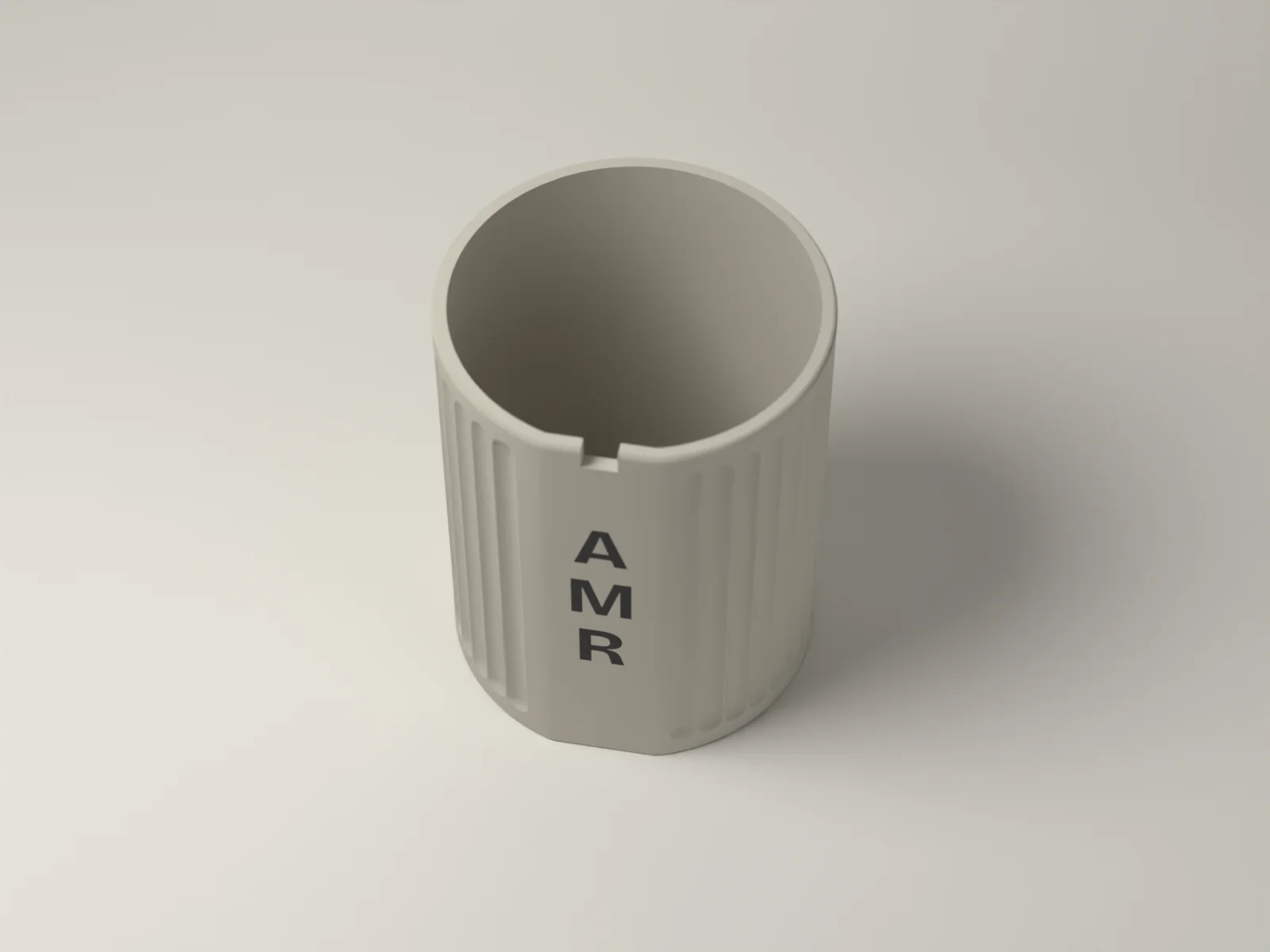 Fluted pen cup from above, showing the keyway notch in the rim and the rounded floor inside