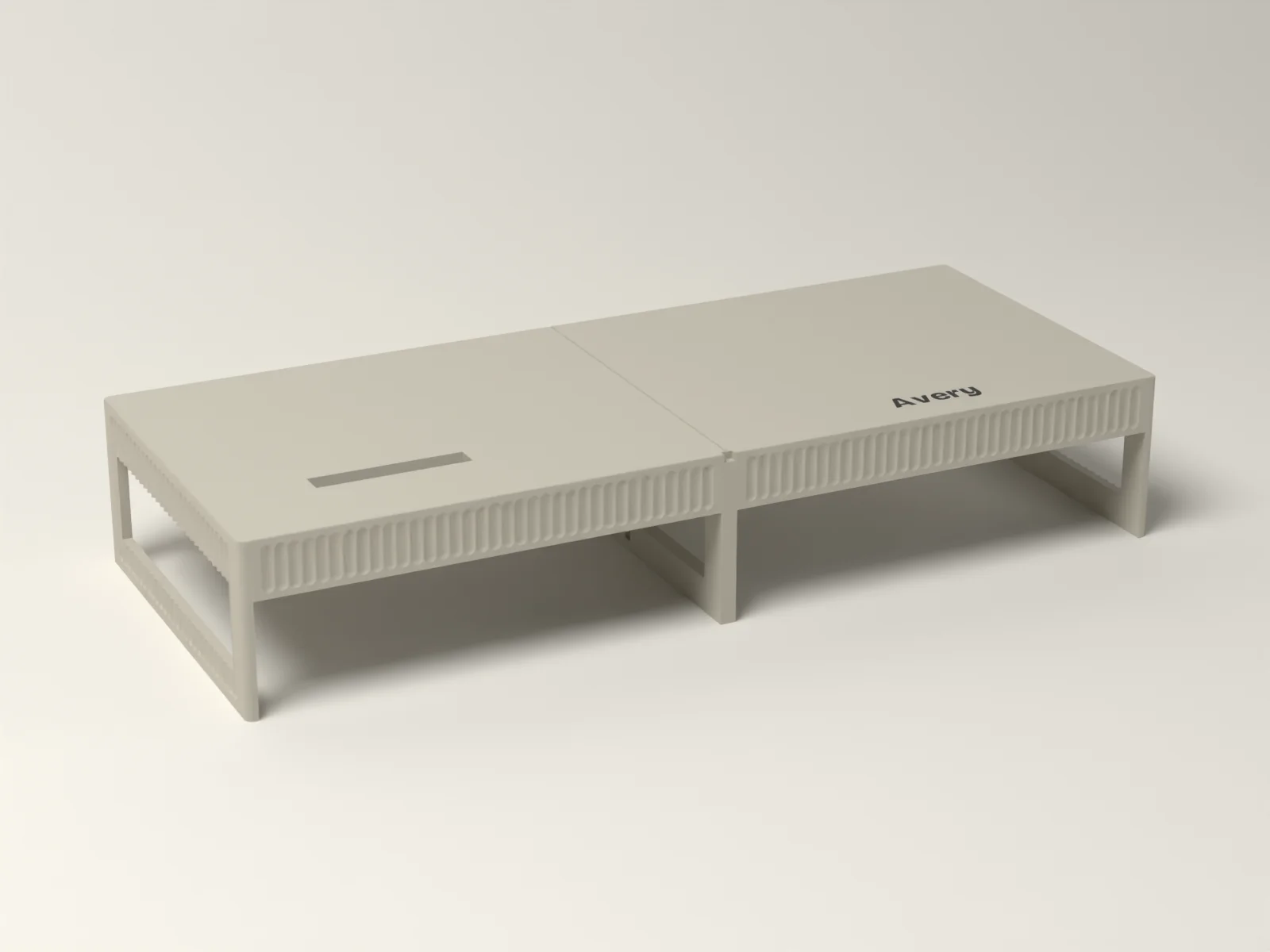 Monitor riser, three quarter view, showing the fluted front, the fluted end leg and the phone slot on the left