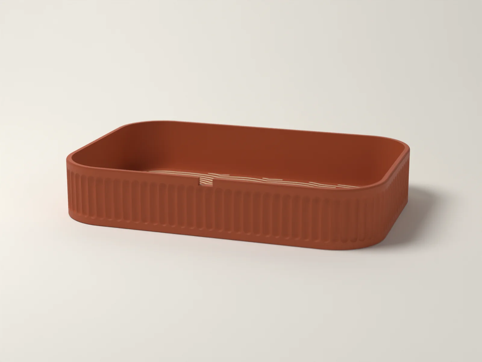 Valet tray from a low angle, showing the fine flutes on the outside wall and the keyway notch in the rim
