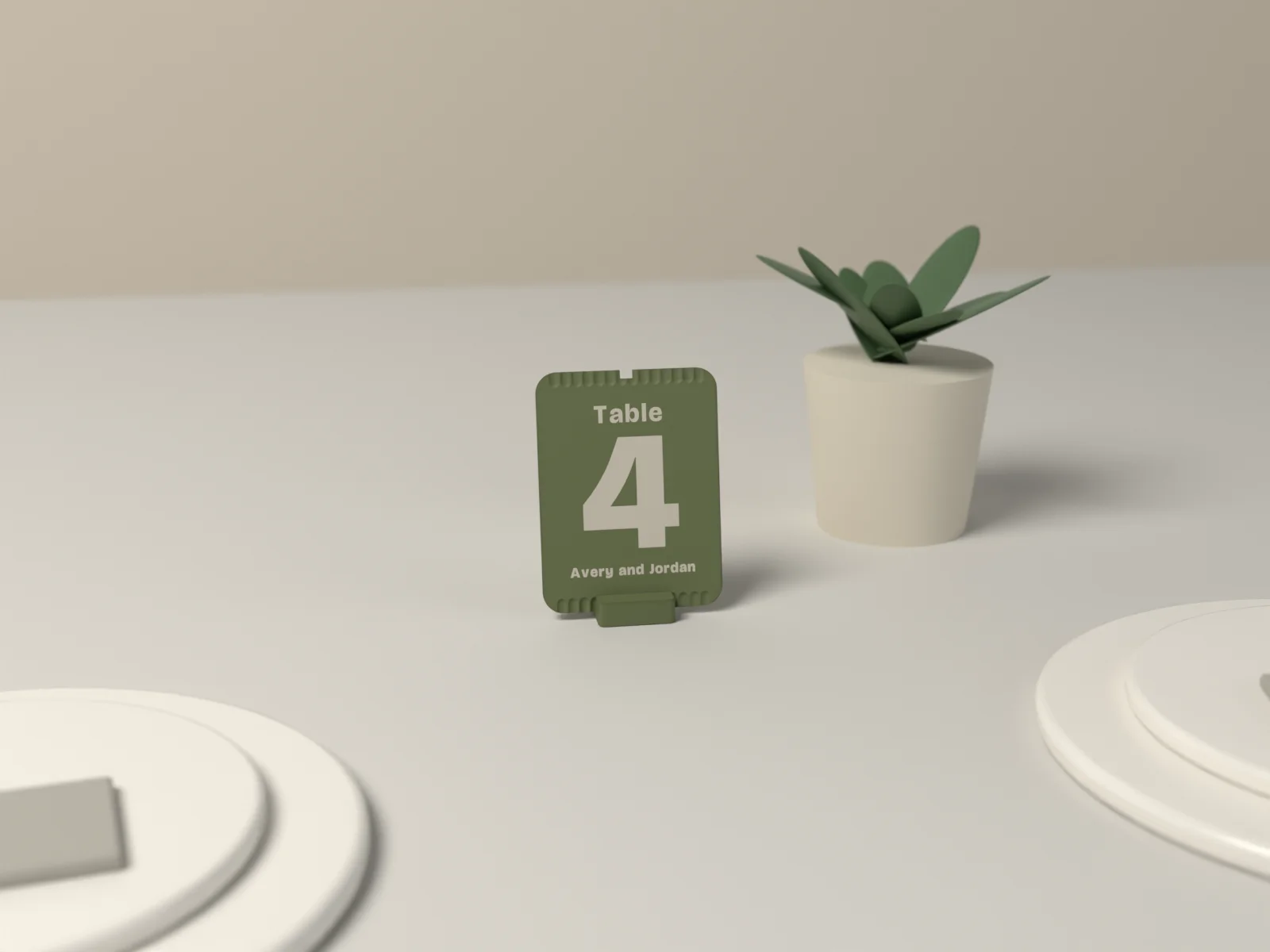 Table number in Library standing between two place settings on a linen tablecloth, a small plant behind