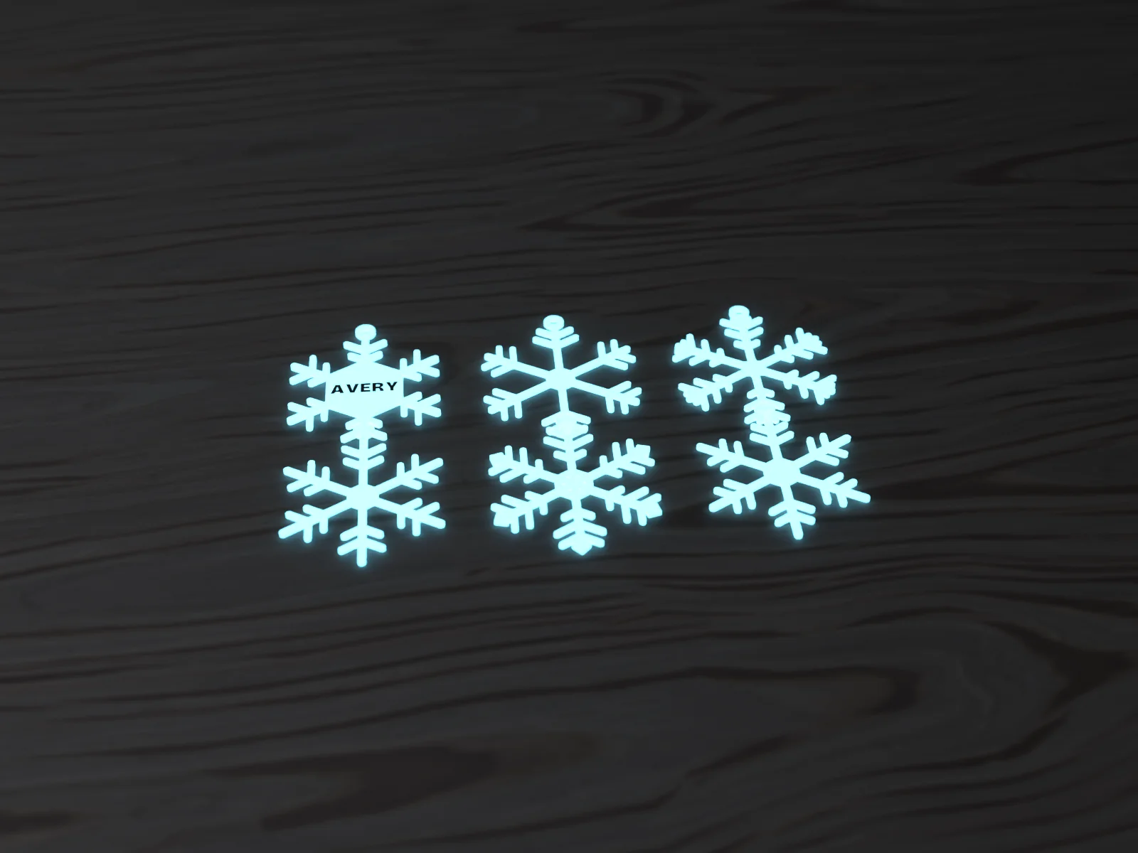 Glow snowflakes hanging on a dark tree, glowing blue